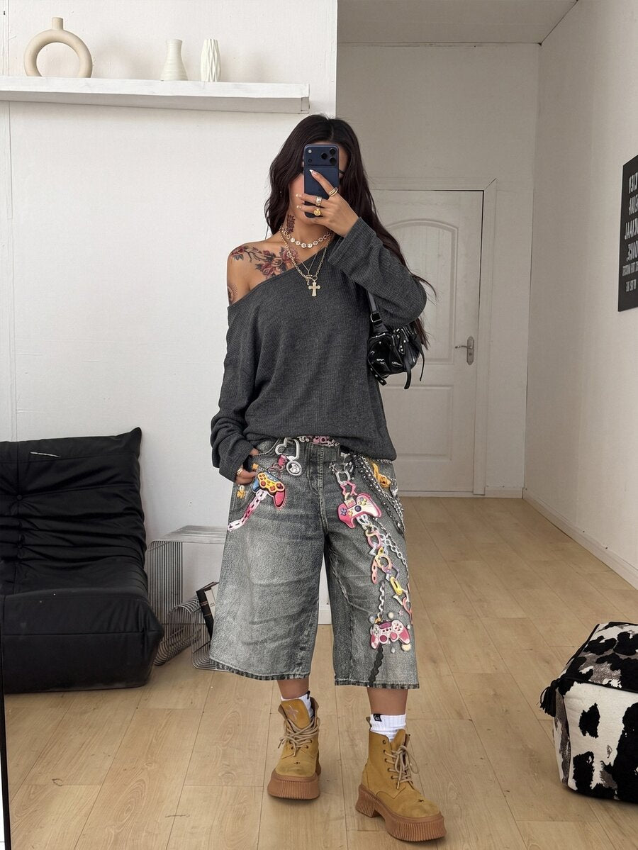 Women's off the shoulder long sleeve t-shirt featuring an asymmetrical neckline and loose fit in soft knitted fabric.