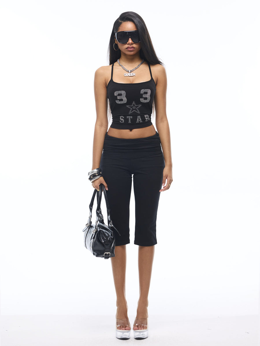 Women's black capri pants with an elastic waistband crafted in a stretchy cotton-blend knit fabric