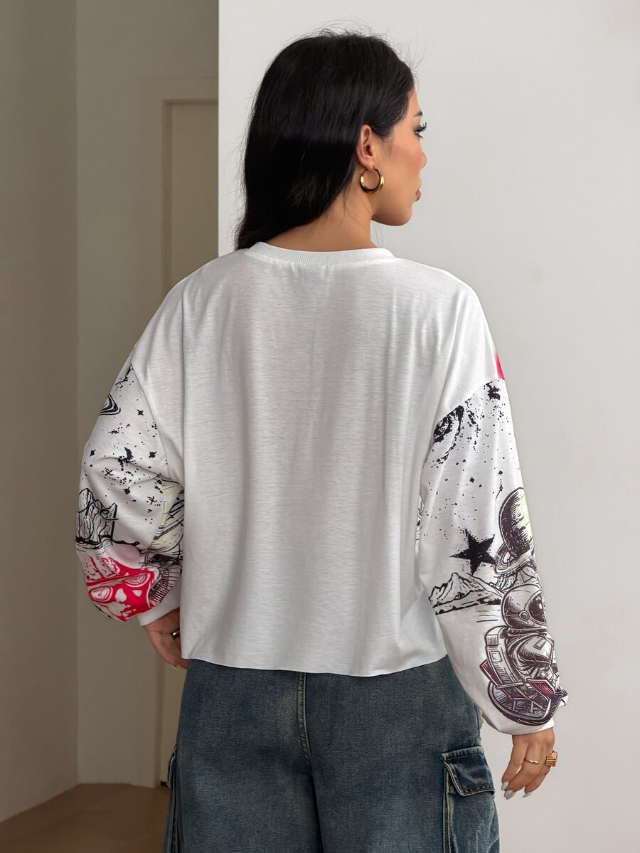 Women's white oversized long sleeve graphic T-shirt with drop shoulders and a round neckline.