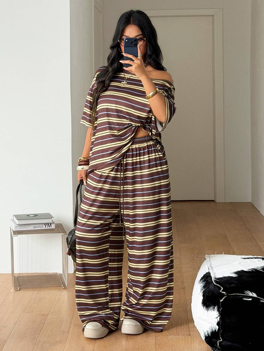 Women's two-piece lounge set featuring a loose drop shoulder asymmetrical neck short sleeve t-shirt and wide-leg knit pants with pockets.