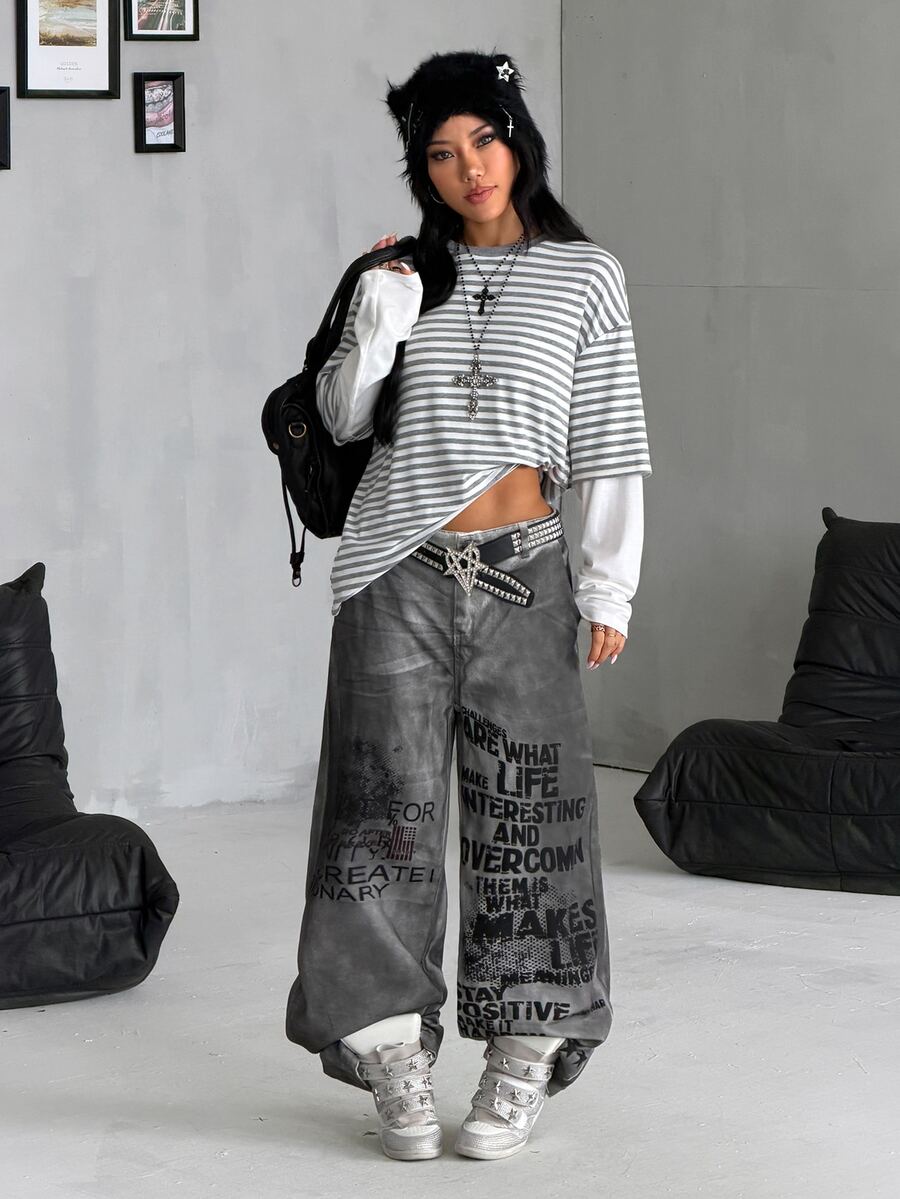 Women's casual graphic long sleeve t-shirt with a round neck, drop shoulder sleeves, and loose relaxed fit.