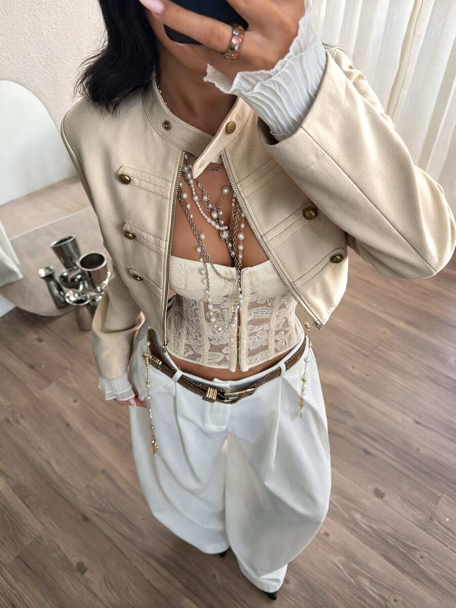 Women's metallic grey cropped faux leather jacket featuring a stand collar and asymmetrical zip front closure.