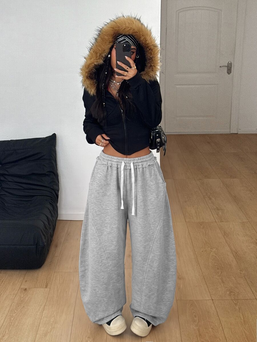 Women's casual grey plaid sweatpants featuring an elastic drawstring waistband, side pockets, and a relaxed loose fit.