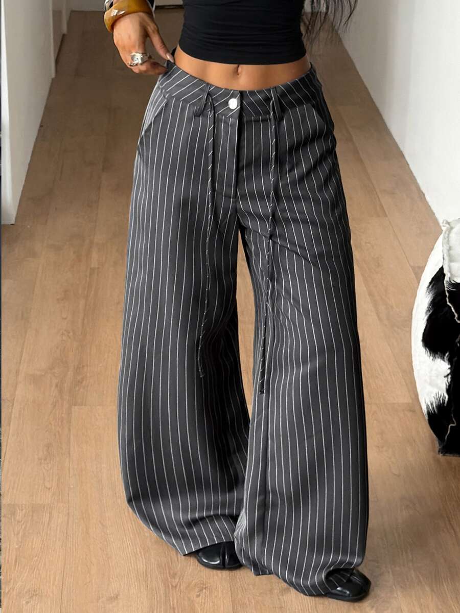 Women's casual straight leg striped woven pants featuring a low waist and zipper fly closure.