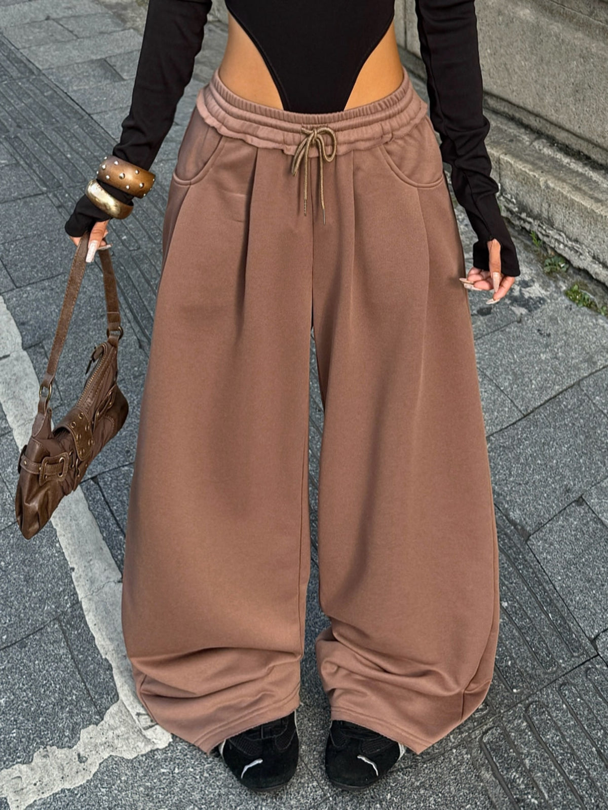 Women's casual straight leg baggy lounge pants in light grey with an adjustable drawstring waist and side pockets.