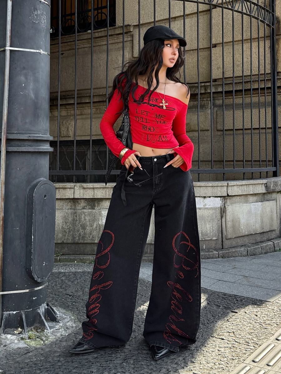 Front view of women's loose wide leg denim jeans featuring a mid waist, classic front pockets, and a zipper fly closure.