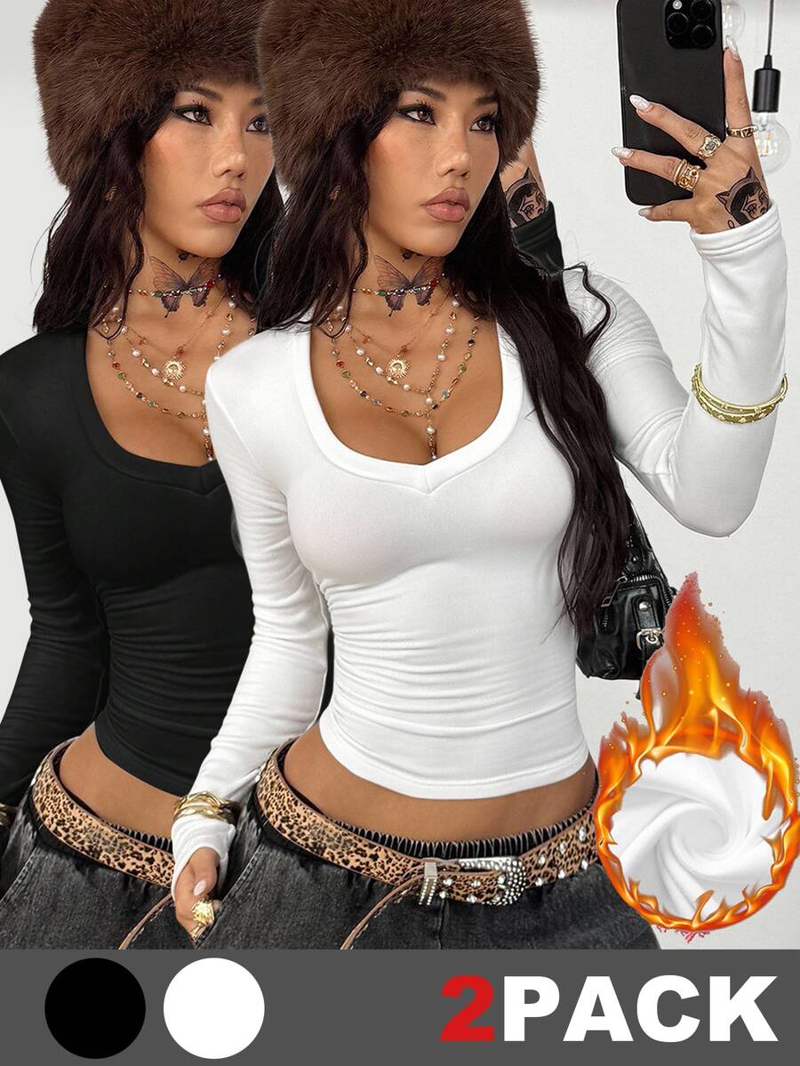 Women's fitted long sleeve rib-knit top featuring a deep V-neckline with delicate contrast lace detailing.