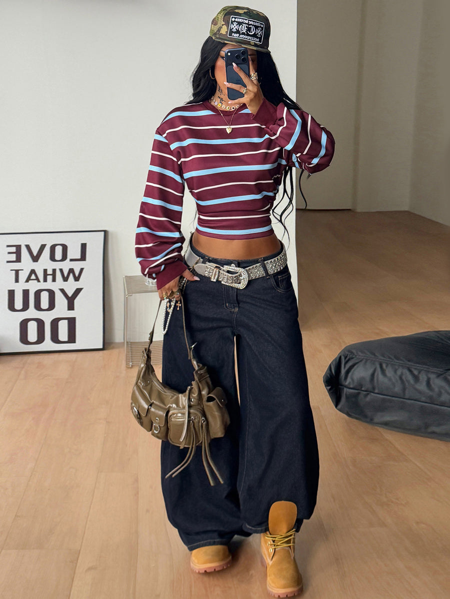 Women's striped pullover sweatshirt featuring drop shoulder long sleeves and a classic round neckline.