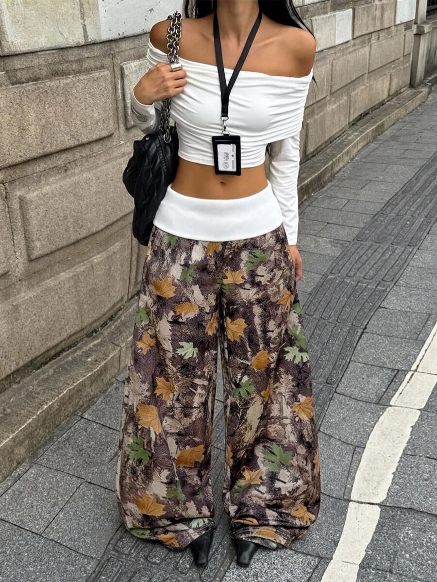 Women's wide leg trousers with a tree branch graphic pattern, loose fit, and mid-rise waist in woven fabric.