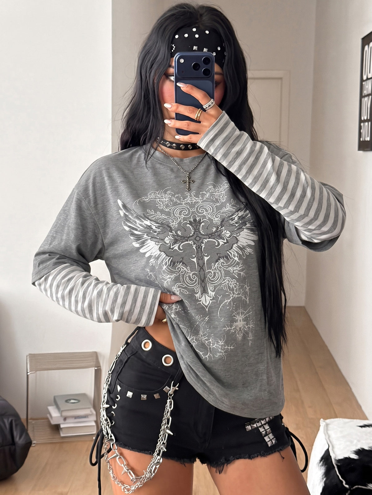 Women's casual graphic long sleeve t-shirt with a round neck, drop shoulder sleeves, and loose relaxed fit.