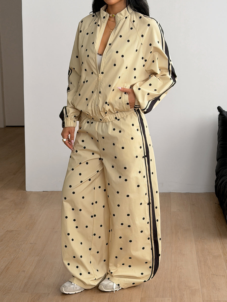 Women's two-piece sporty casual tracksuit set featuring a stand collar zip-up jacket with contrast binding and matching loose parachute pants.