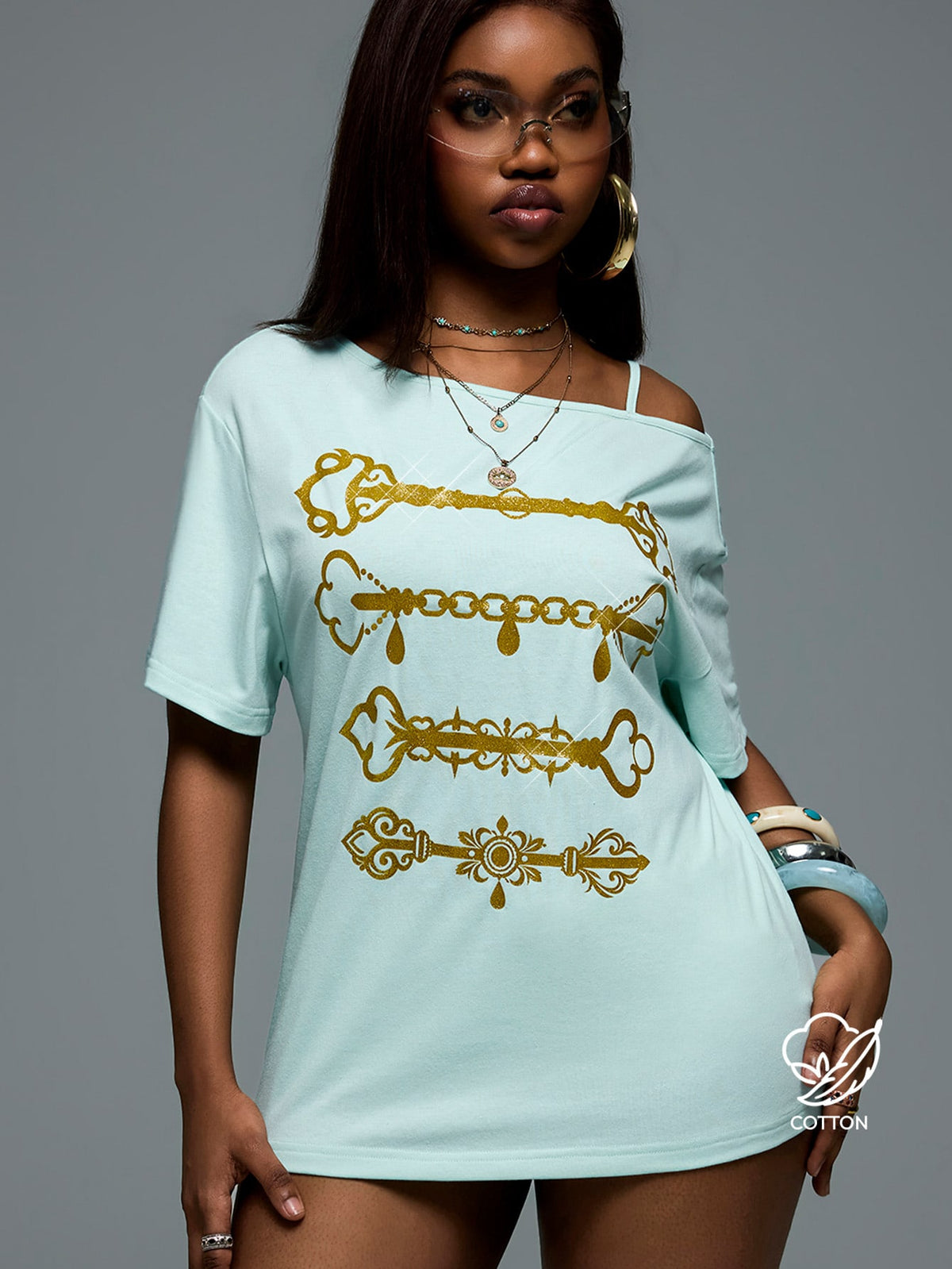 Women's casual loose fit cold shoulder cotton t-shirt with asymmetrical cutout neckline and short sleeves.