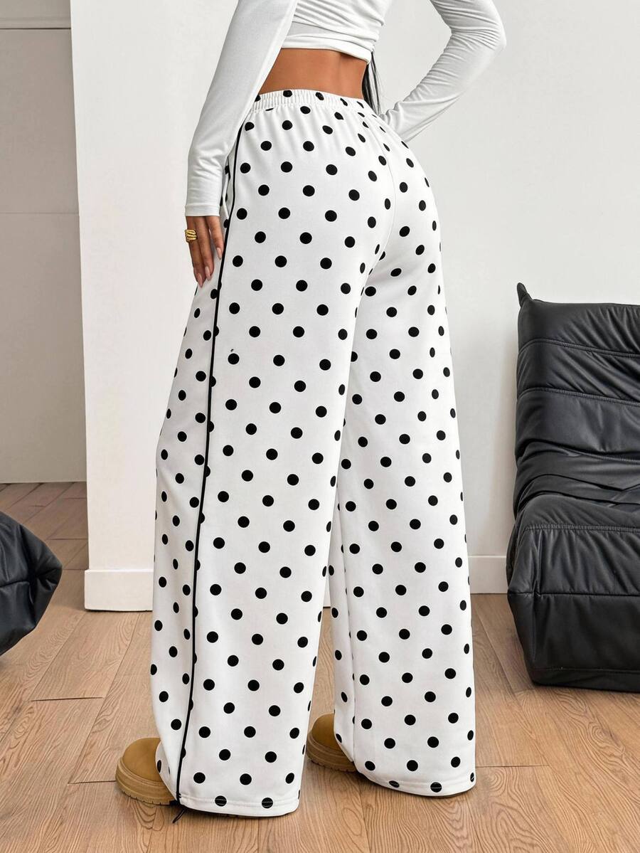 Women's loose fit wide leg graphic sweatpants in light grey with an elastic drawstring waistband