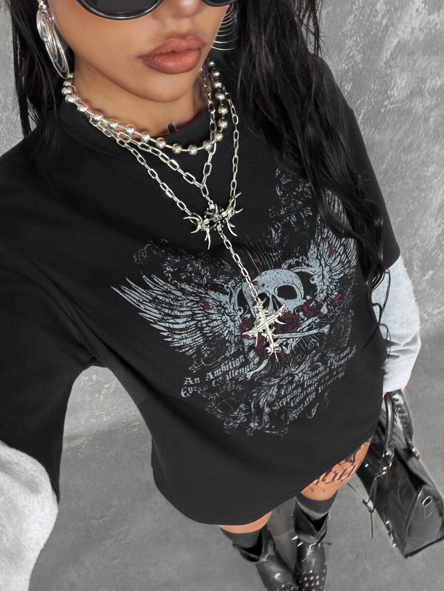 Women's casual graphic long sleeve t-shirt with a round neck, drop shoulder sleeves, and loose relaxed fit.