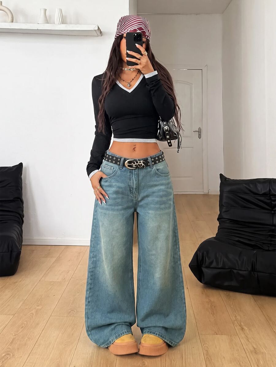 Women's loose wide-leg jeans in light wash denim with low waist and extra-long relaxed fit