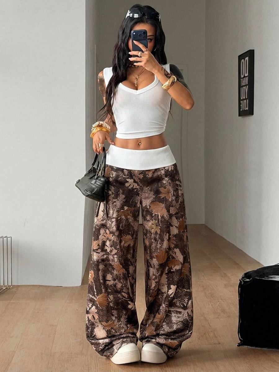 Women's wide leg trousers with a tree branch graphic pattern, loose fit, and mid-rise waist in woven fabric.