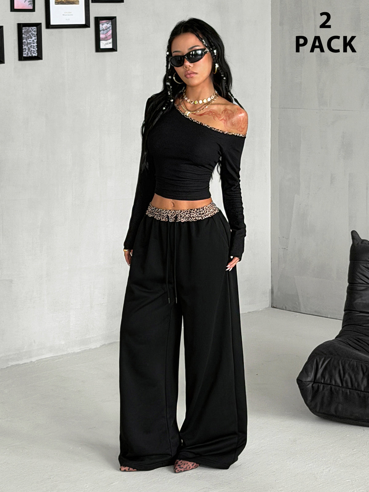 Women's two-piece striped knit tracksuit set featuring a brown asymmetrical neckline long sleeve crop top and matching high-waisted wide leg sweatpants.