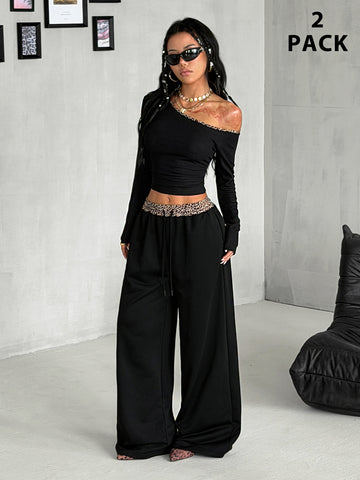 Women's two-piece striped knit tracksuit set featuring a brown asymmetrical neckline long sleeve crop top and matching high-waisted wide leg sweatpants.