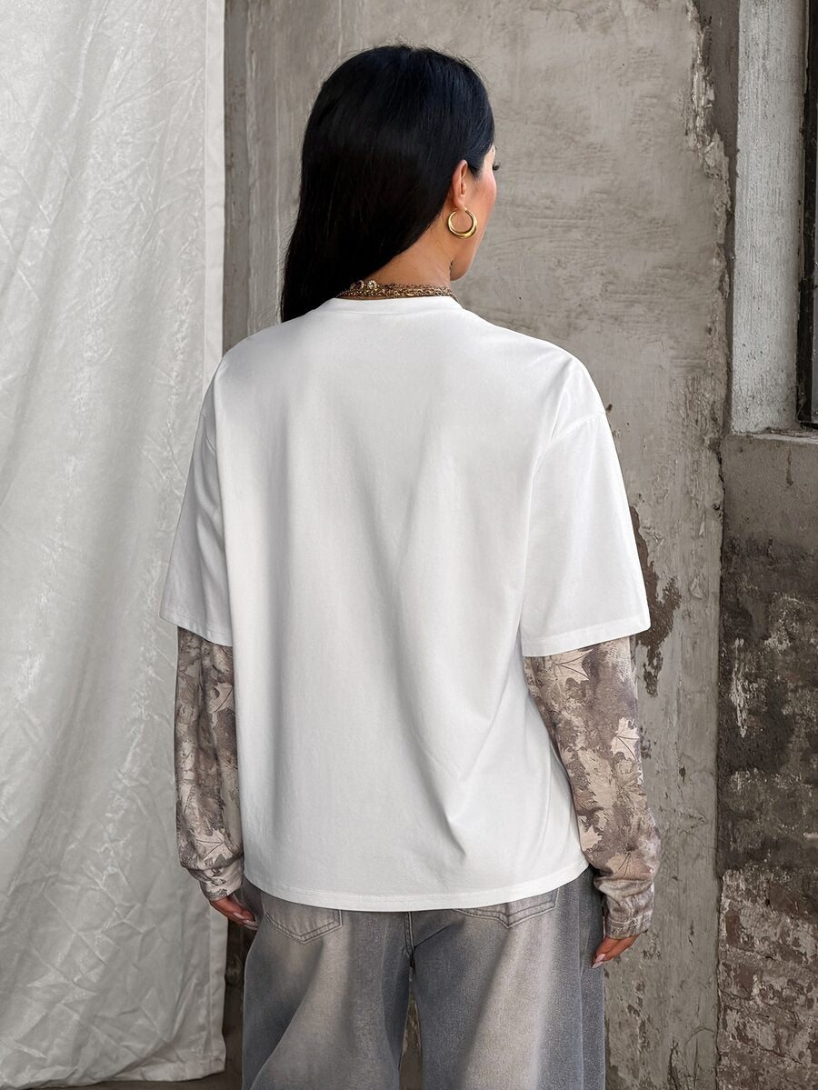 Women's casual graphic long sleeve t-shirt with a round neck, drop shoulder sleeves, and loose relaxed fit.
