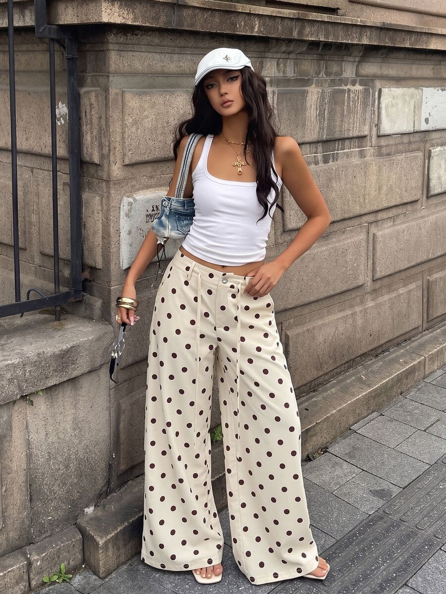 Women's casual straight leg striped woven pants featuring a low waist and zipper fly closure.