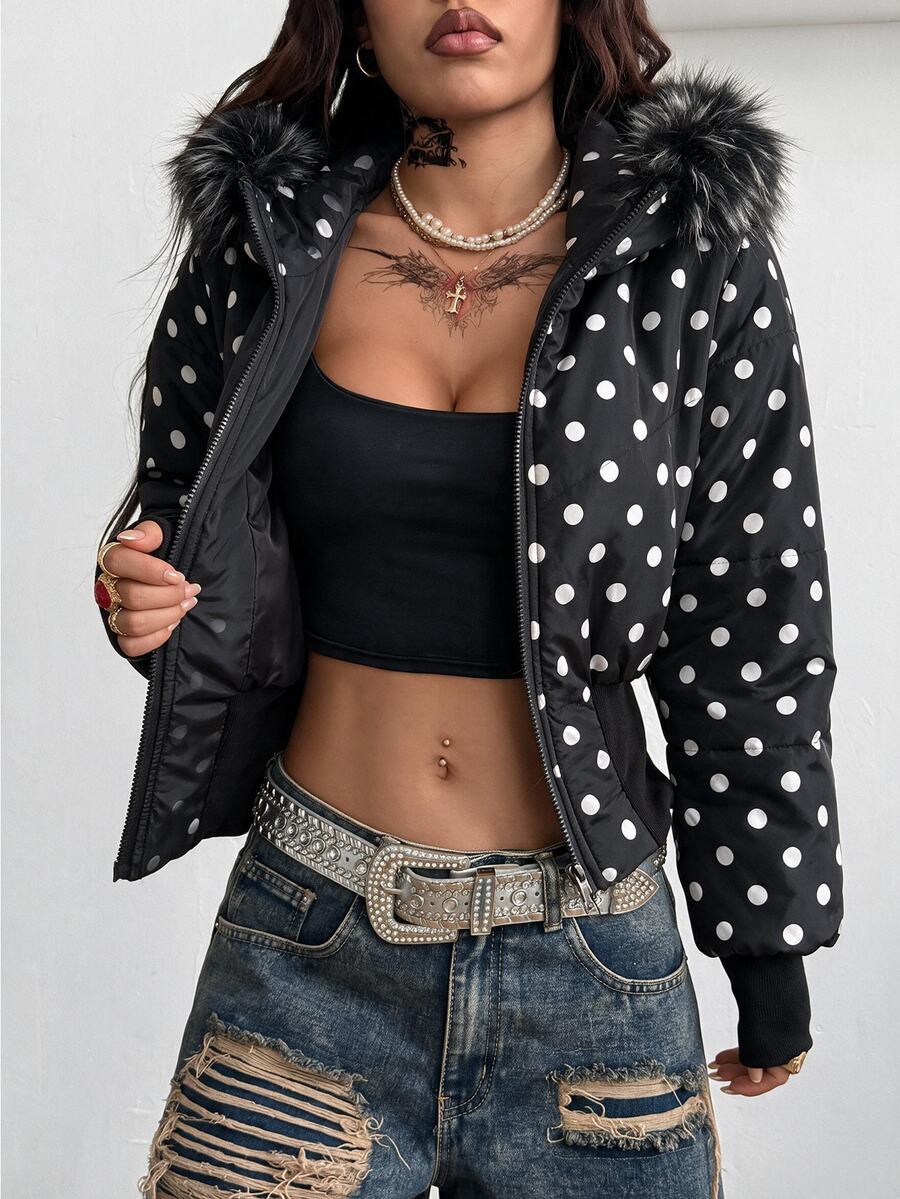 Women's brown cropped puffer jacket featuring a faux fur trimmed hood, front zipper, and ribbed hem.