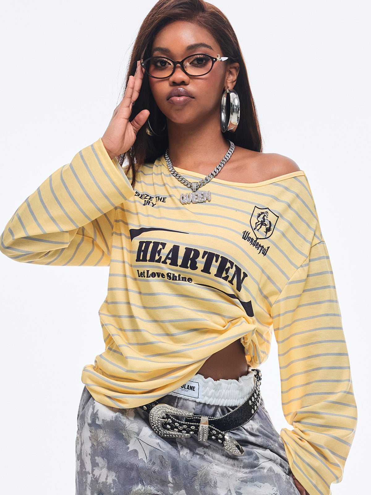Women's brown striped boat neck long sleeve raglan T-shirt with a loose casual fit