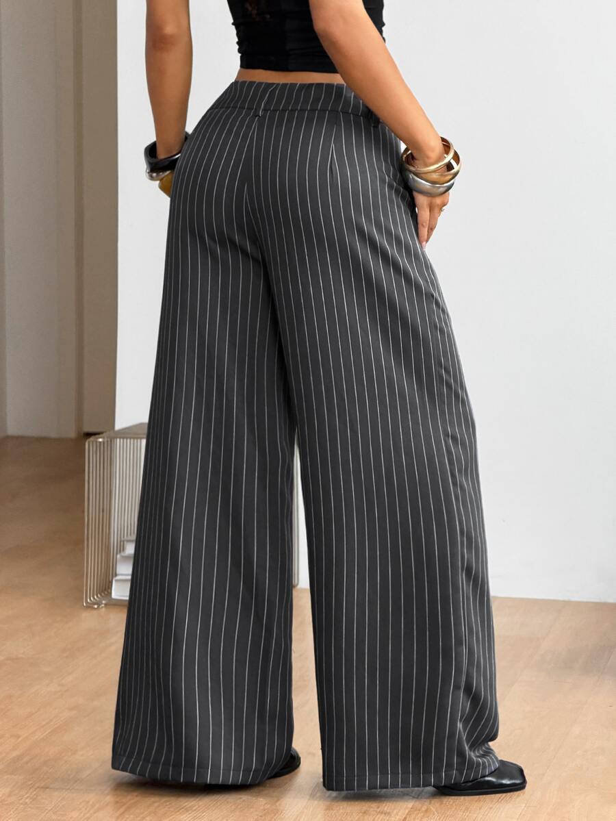 Women's casual straight leg striped woven pants featuring a low waist and zipper fly closure.