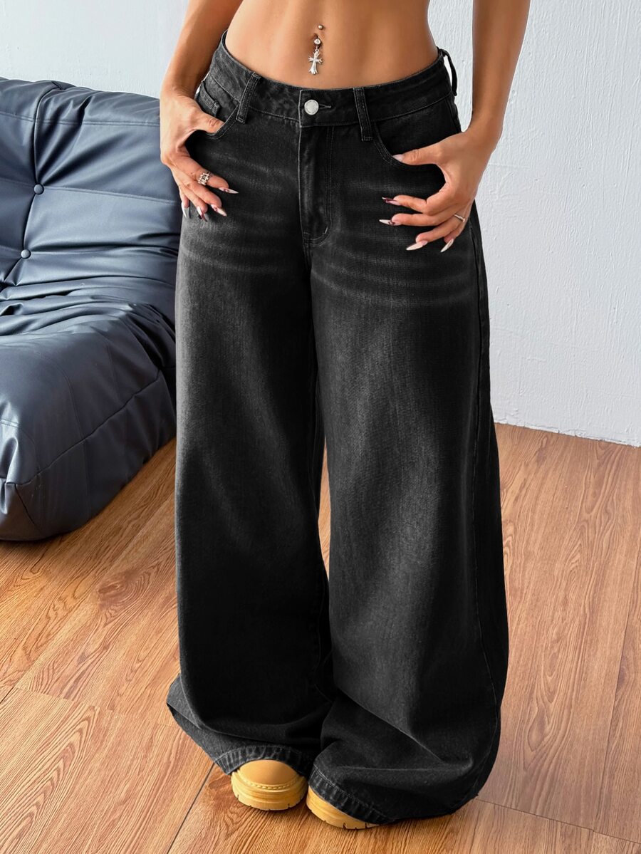 Women's relaxed fit wide leg denim jeans with pockets and a zipper fly.