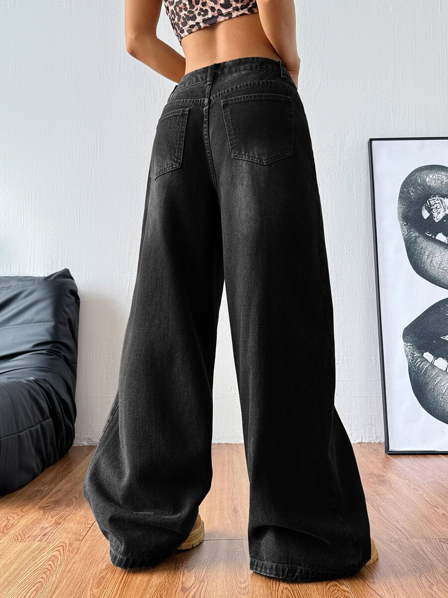 Women's relaxed fit wide leg denim jeans with pockets and a zipper fly.
