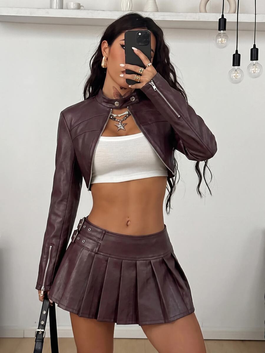 Women's khaki cropped military jacket featuring decorative Napoleon trim, long regular sleeves, tie neck, grommet eyelets, and single-breasted front closure.