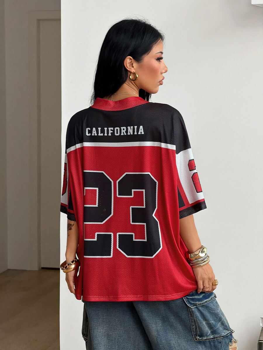 Women's oversized short sleeve graphic T-shirt with vintage digital geometric print, V-neck, and asymmetrical hem