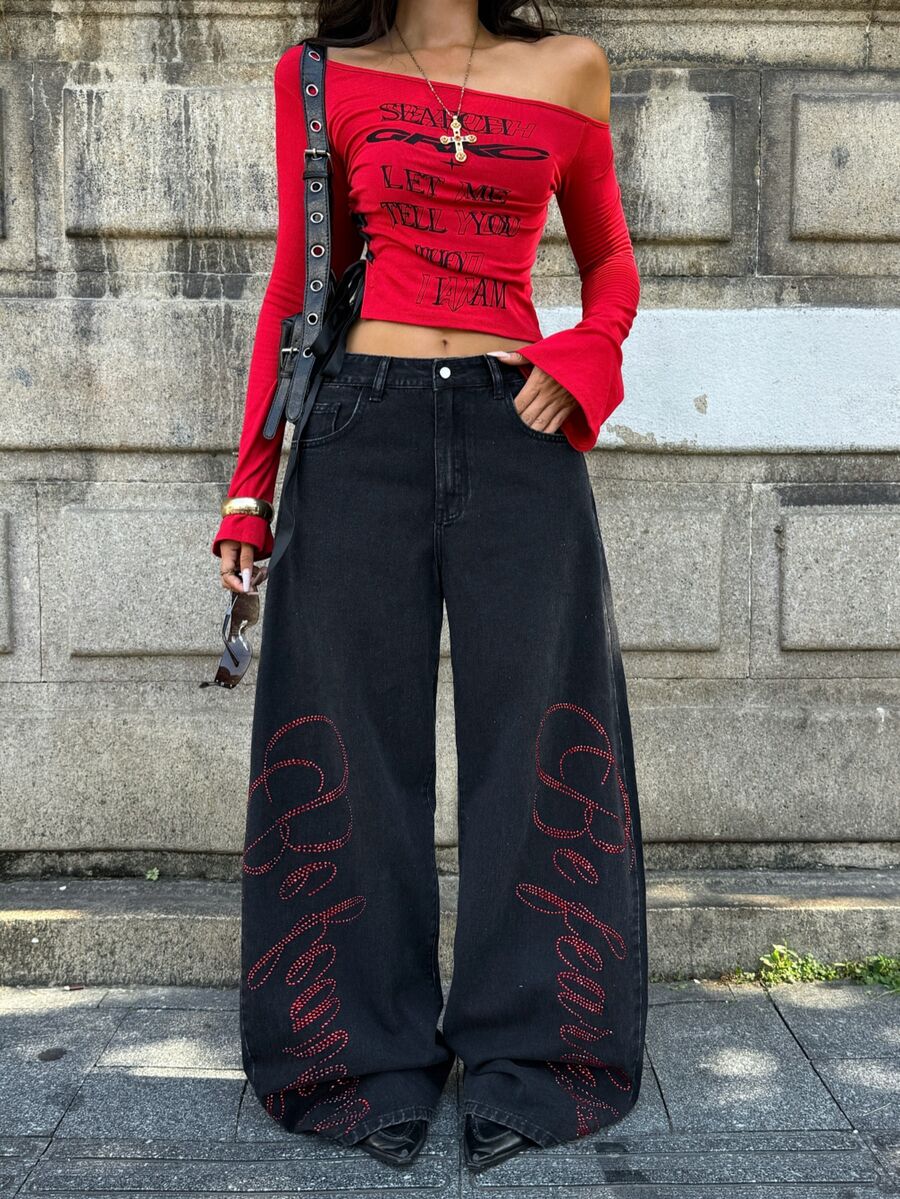 Front view of women's loose wide leg denim jeans featuring a mid waist, classic front pockets, and a zipper fly closure.
