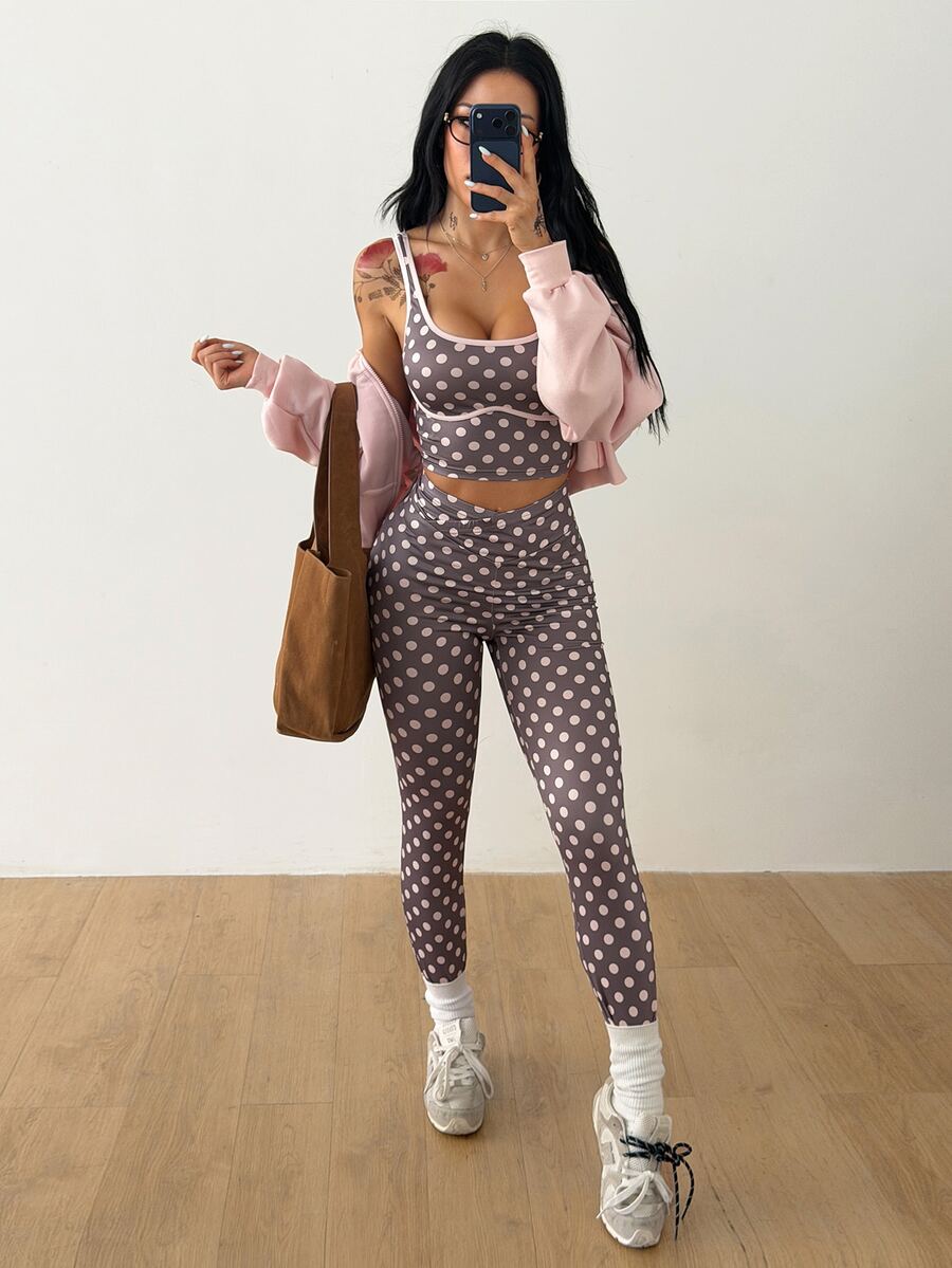 Women's two-piece activewear set featuring a multicolor polka dot backless crop top and matching slim-fit leggings.