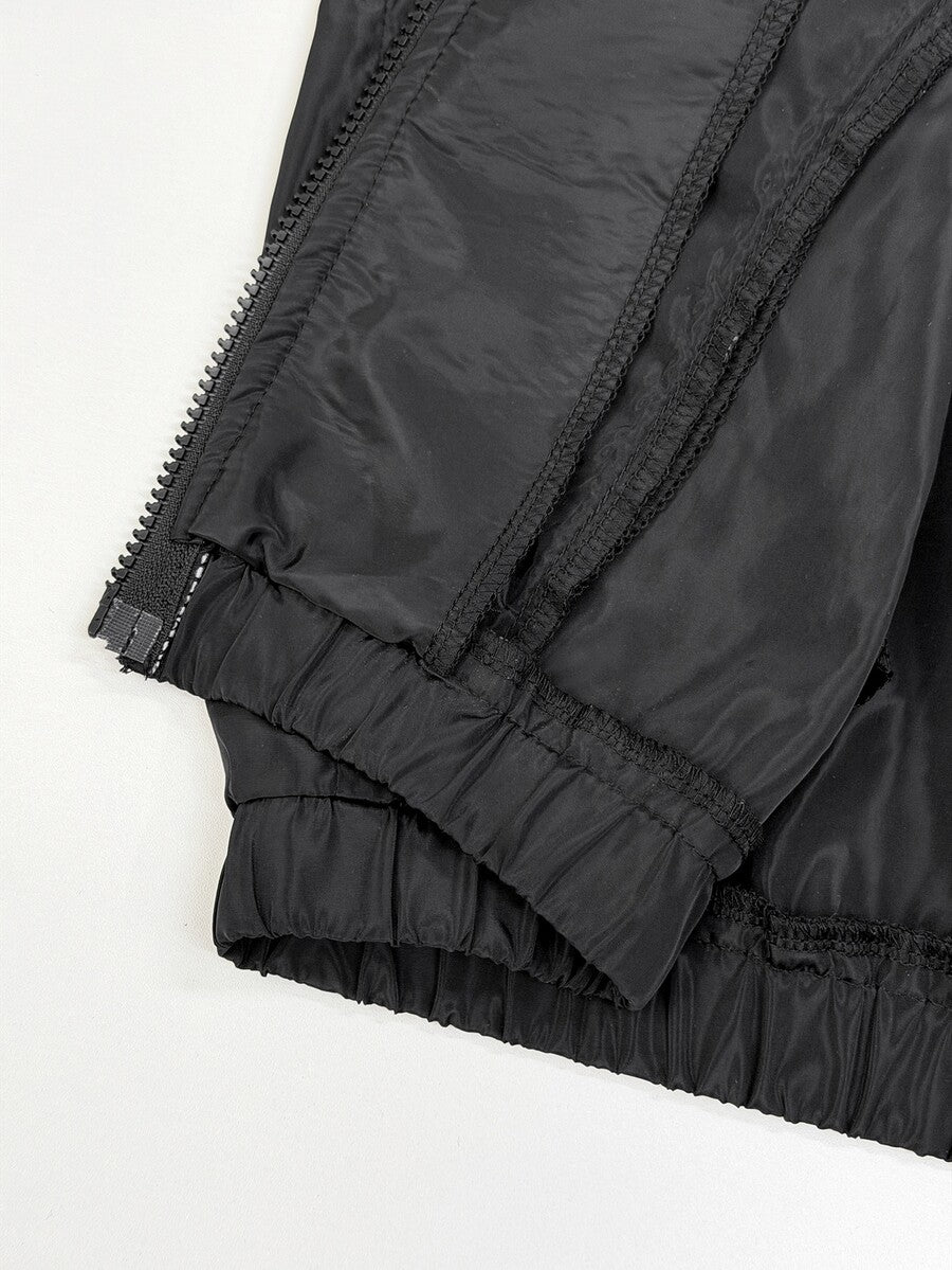 Women's black casual windbreaker jacket featuring a stand collar, raglan long sleeves, front zipper closure, and side pockets.