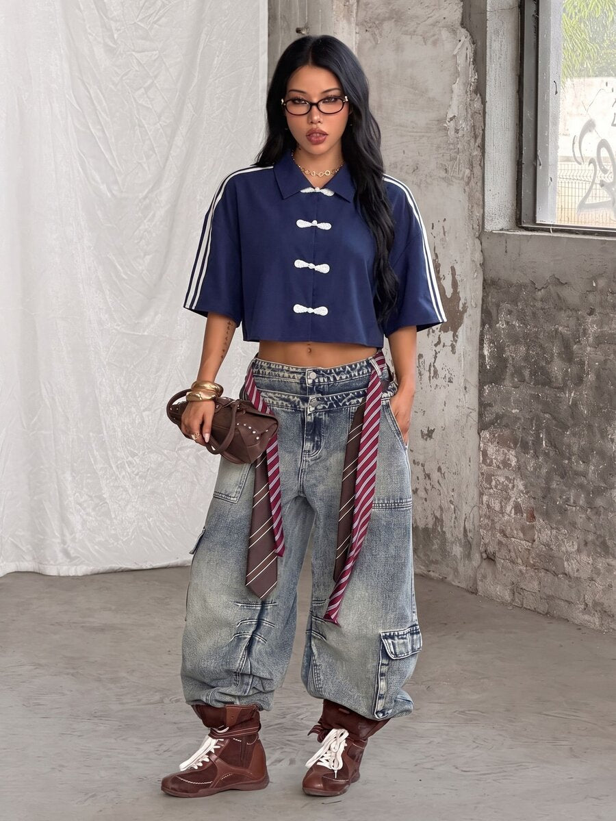 Women's plaid crop shirt with button front, chest pocket, short sleeves, and loose casual fit.