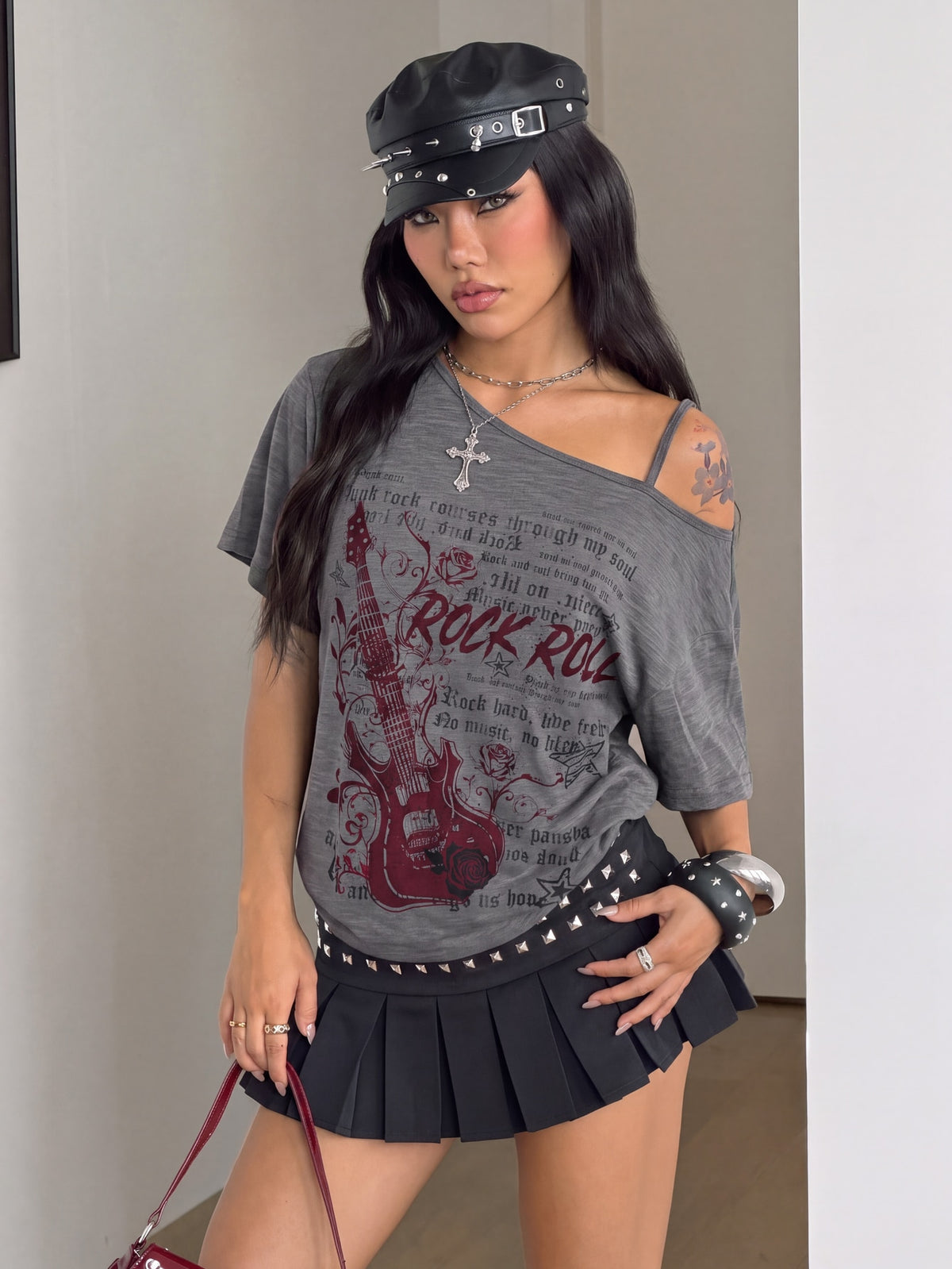Women's casual loose fit cold shoulder cotton t-shirt with asymmetrical cutout neckline and short sleeves.