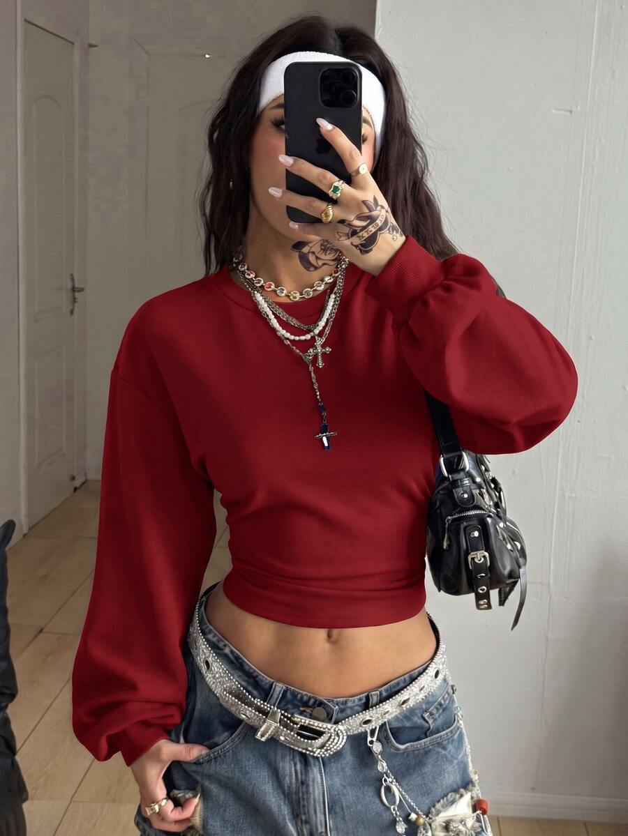 Women's brown waist-cinching sweatshirt featuring a round neck, drop shoulder long sleeves, and rib-knit cuffs.