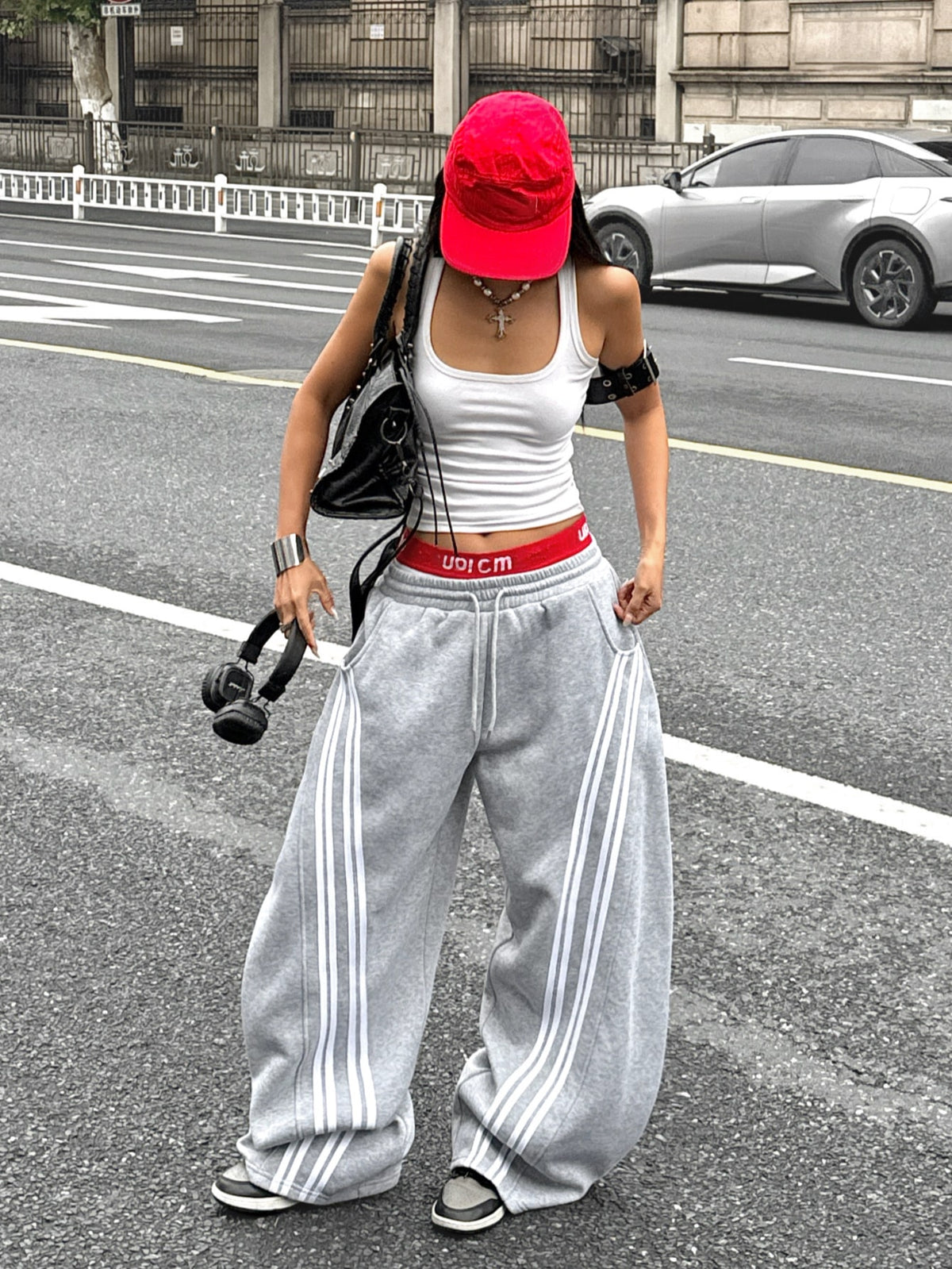 Women's casual grey plaid sweatpants featuring an elastic drawstring waistband, side pockets, and a relaxed loose fit.