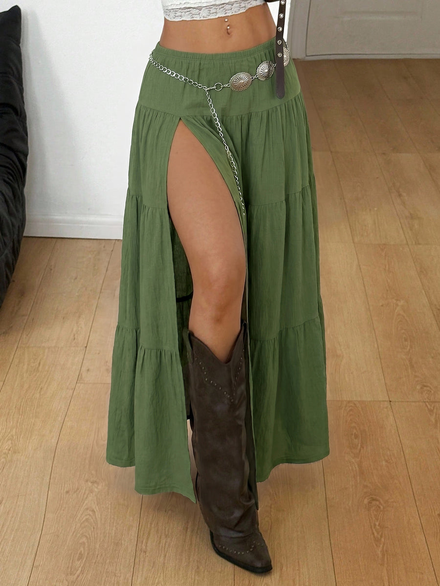 Women's red plaid long skirt featuring a low-rise waist and a side slit in lightweight woven fabric.