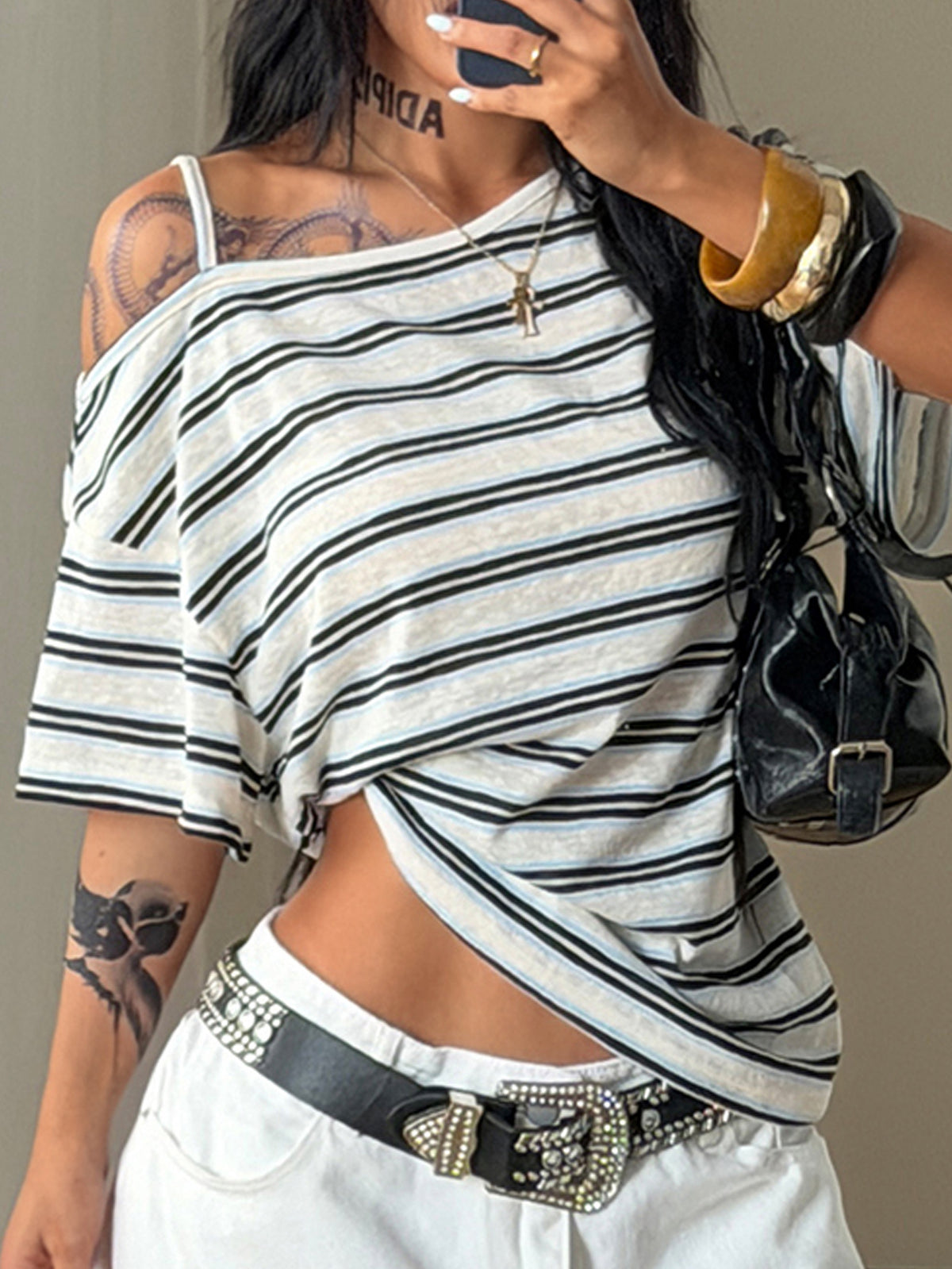 Women's casual loose fit cold shoulder cotton t-shirt with asymmetrical cutout neckline and short sleeves.