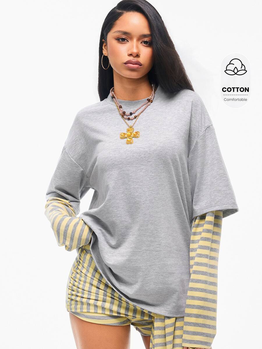 Women's casual graphic long sleeve t-shirt with a round neck, drop shoulder sleeves, and loose relaxed fit.