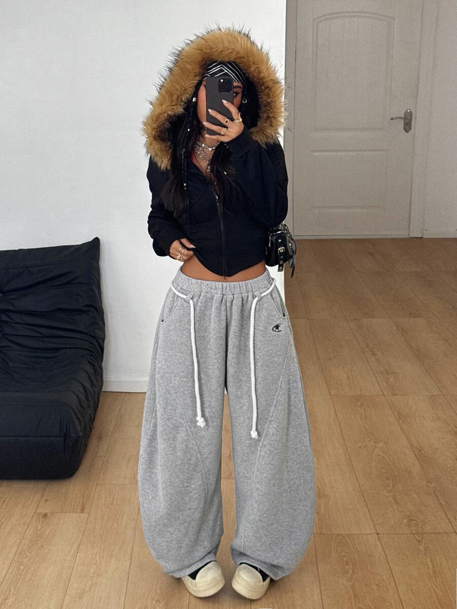 Women's casual grey plaid sweatpants featuring an elastic drawstring waistband, side pockets, and a relaxed loose fit.
