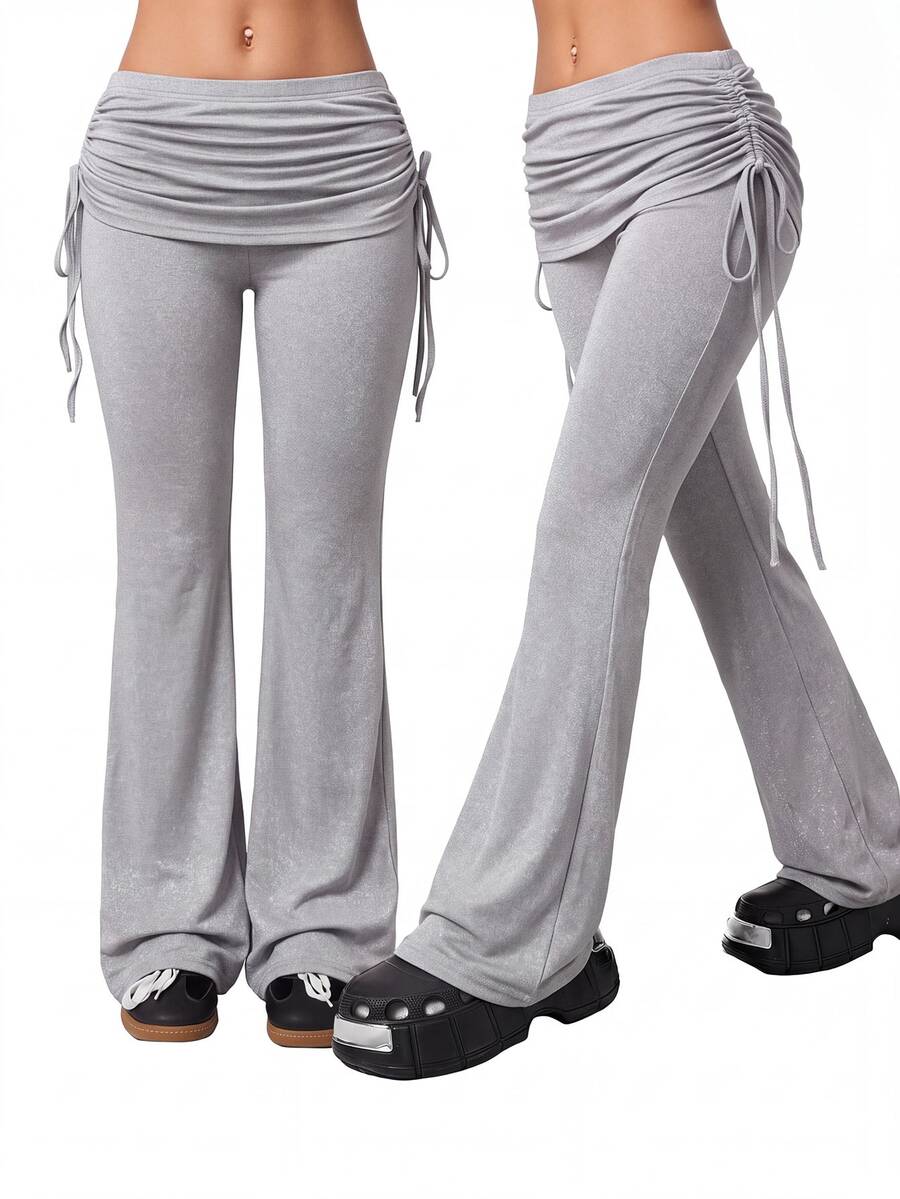 Women's striped flare leg pants featuring a mid-rise waist, slim fit thigh, and ruched side drawstring detail in stretch knit fabric.