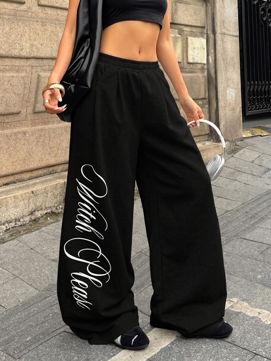 Women's loose wide leg casual sweatpants with an elastic waistband and side pockets