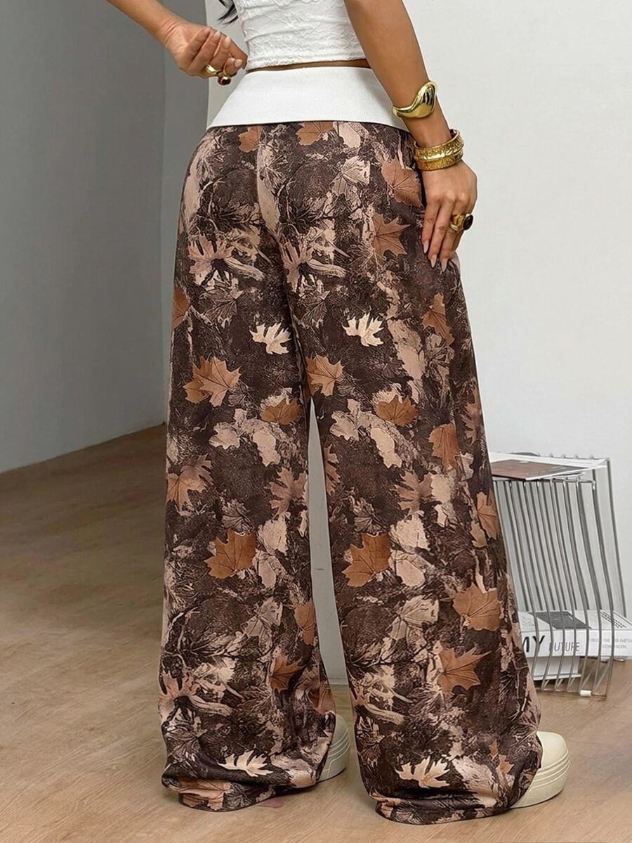 Women's wide leg trousers with a tree branch graphic pattern, loose fit, and mid-rise waist in woven fabric.