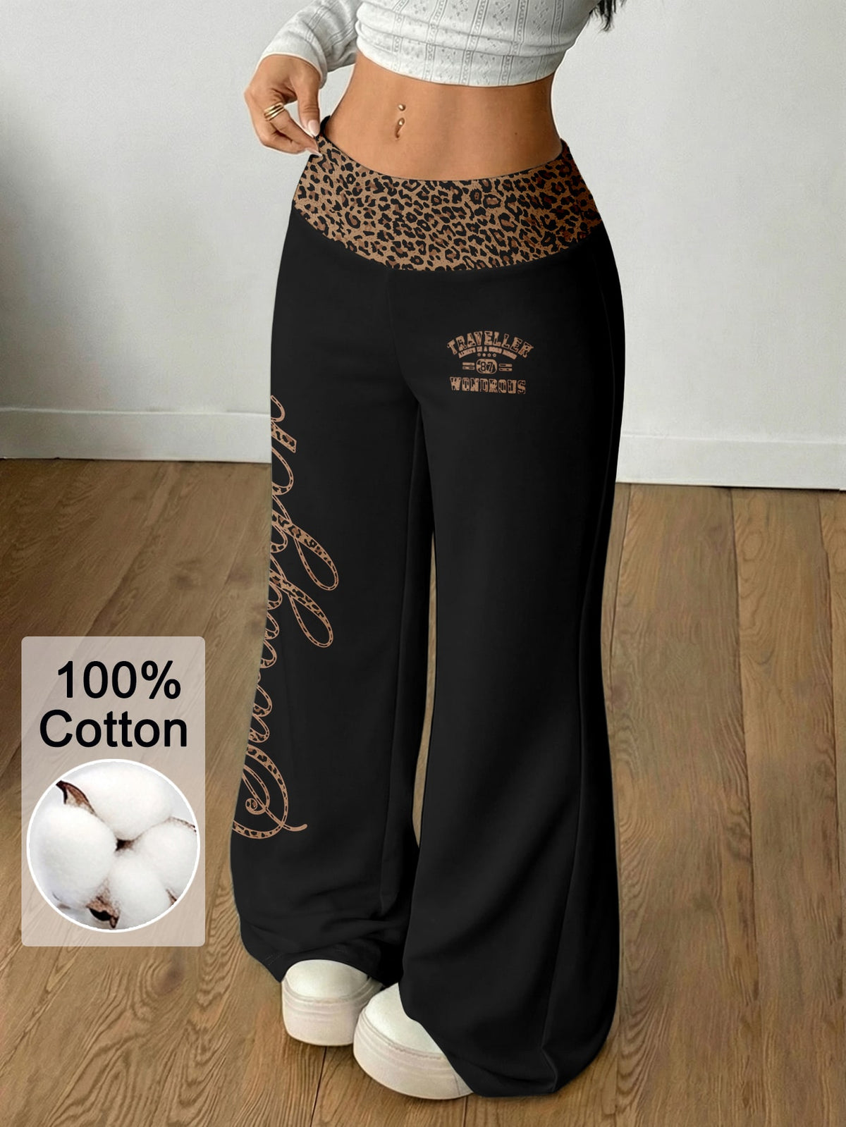 Women's casual straight leg sweatpants featuring a black and white polka dot design with an elastic waistband.