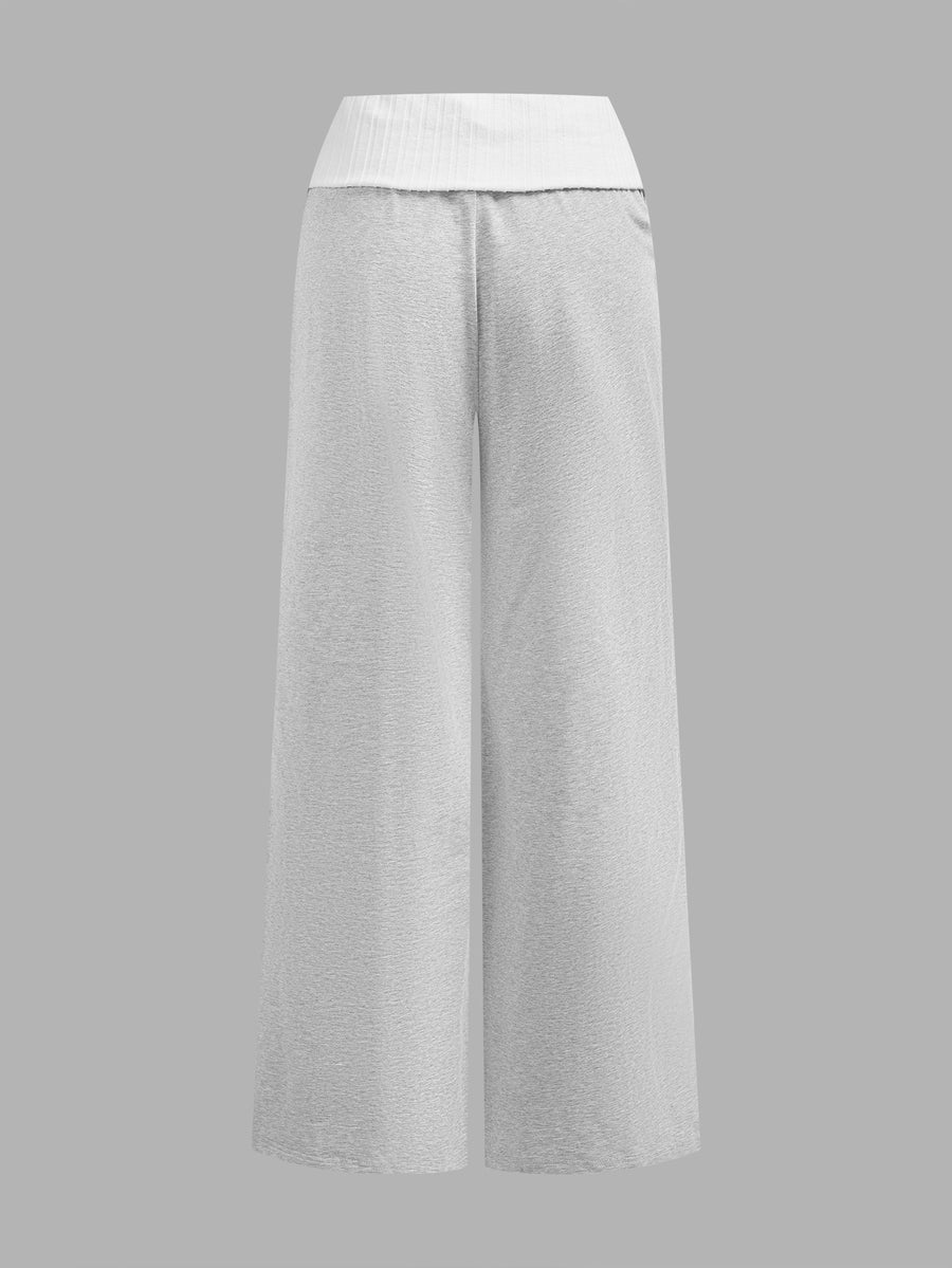 Women's wide leg flare lounge pants made of 95% cotton with a low elastic waistband and extra long hem.