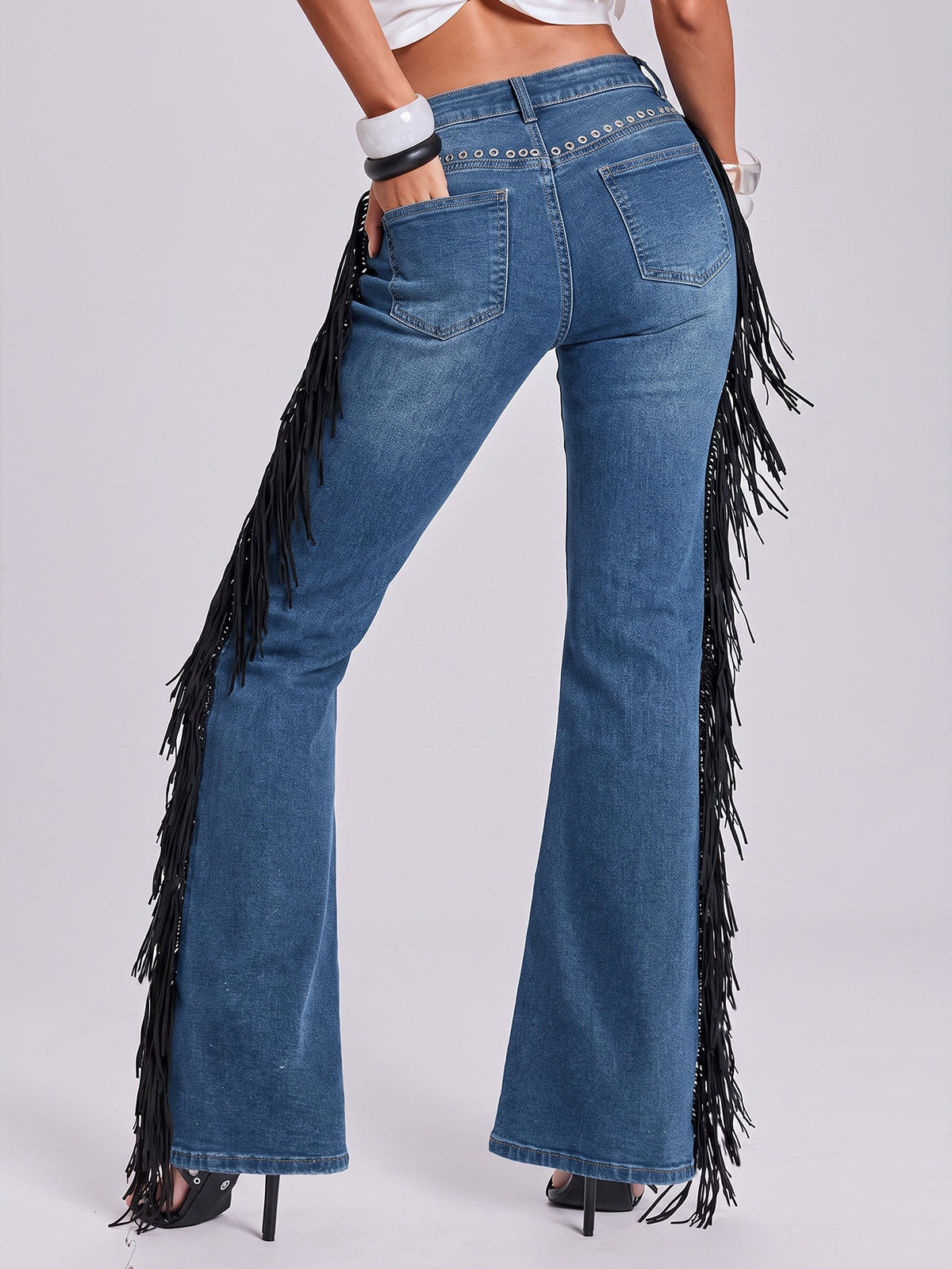 Women's ultra low waist flare jeans in washed stretch denim featuring an extra long bootcut leg and zipper fly closure.