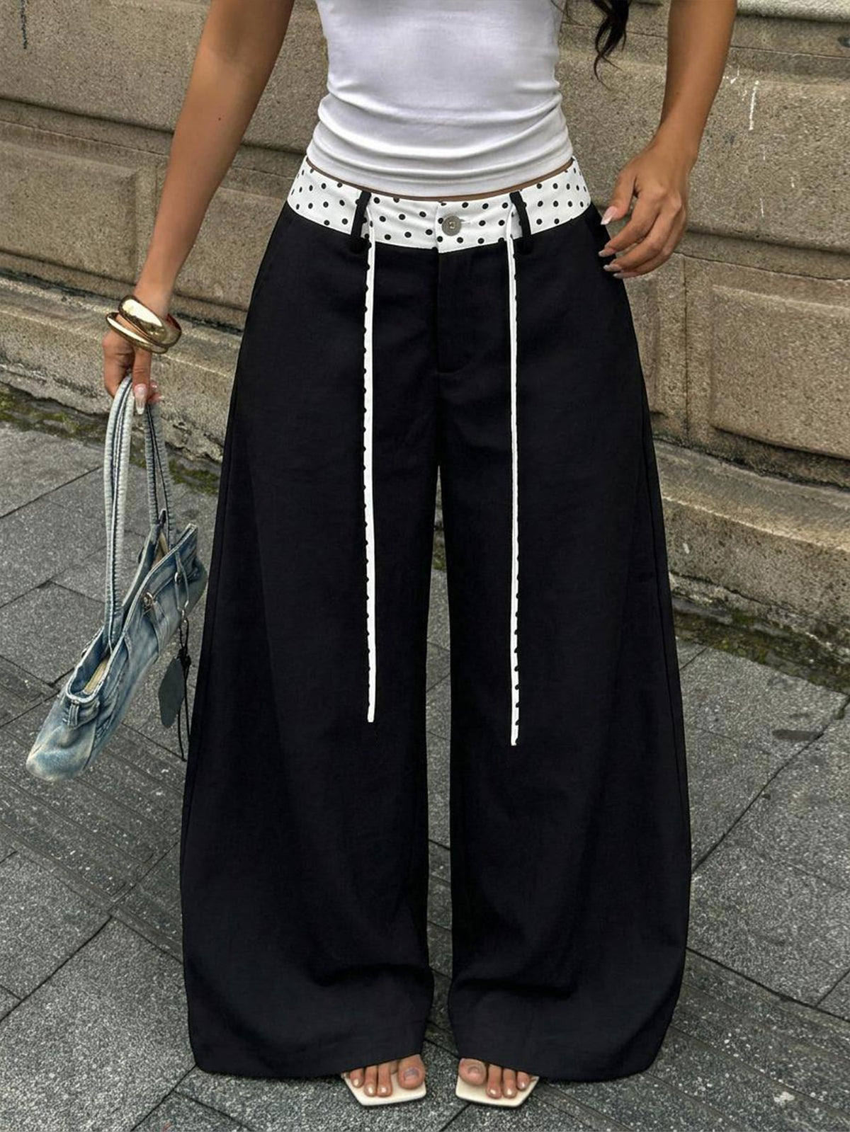 Women's casual straight leg striped woven pants featuring a low waist and zipper fly closure.
