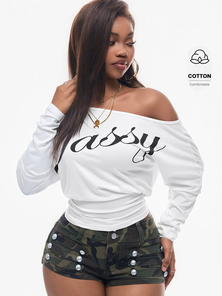 Women's black long sleeve t-shirt featuring delicate contrast lace details and a boat neckline in a knitted stretch fabric.